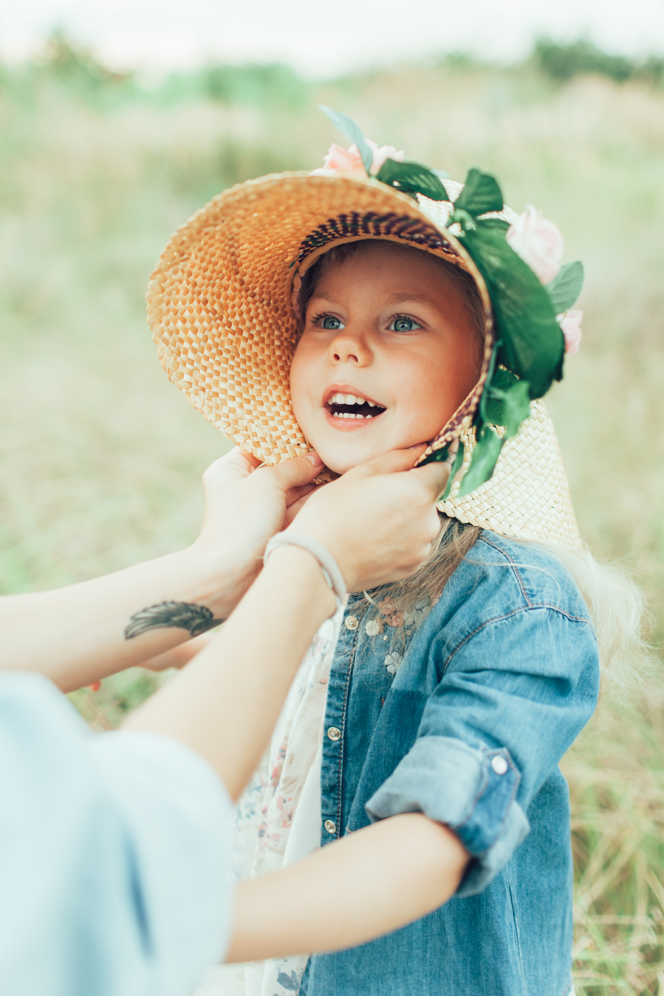 young-mother-daughter-green-grass 1